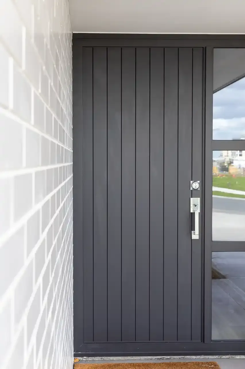  Generation Homes Welcome to Golden Sands Entry white brick dark joinery 